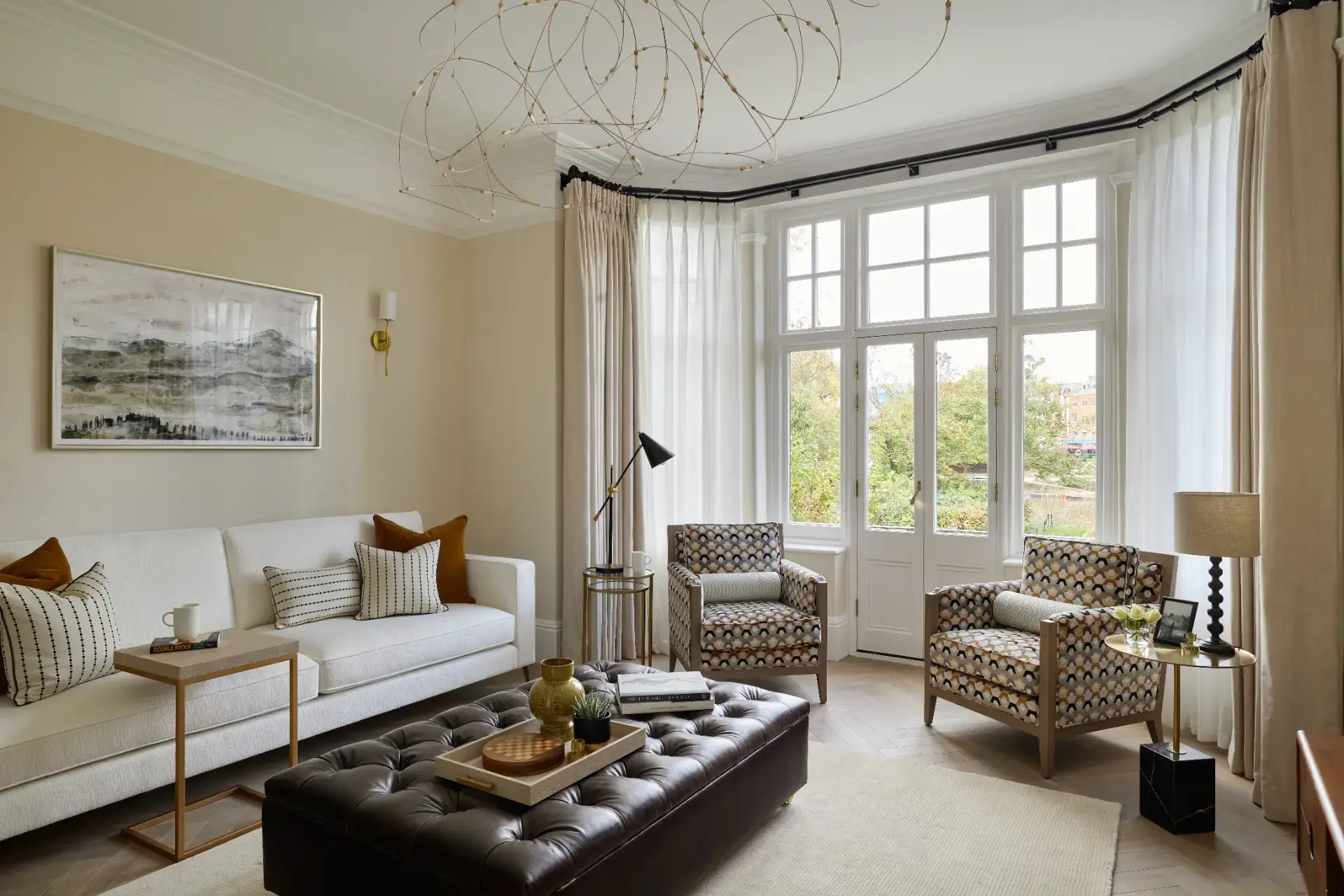 A bright period living room with bespoke curtains